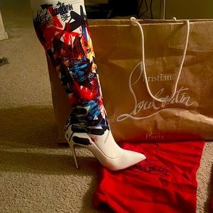 These gorgeous Christian Louboutin boots were never worn. Perfect condition.